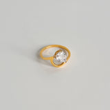 Gold crystal ring with twist